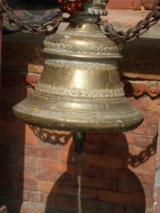 Temple bell in Varanasi, India, by Ally Tantra